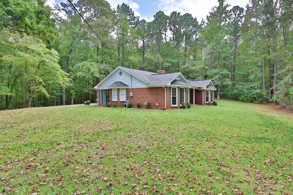 2495 Fortson Road Fortson, GA 31808 - Photo 22 of 30 a front view of a house with yard and green space