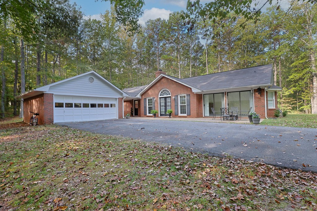 2495 Fortson Road Fortson, GA 31808 - Photo 24 of 30 a view of a house with a yard and large tree