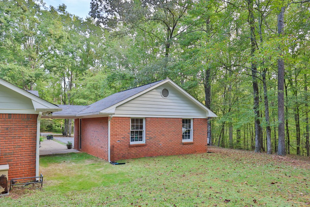 2495 Fortson Road Fortson, GA 31808 - Photo 26 of 30 a front view of a house with yard and tree