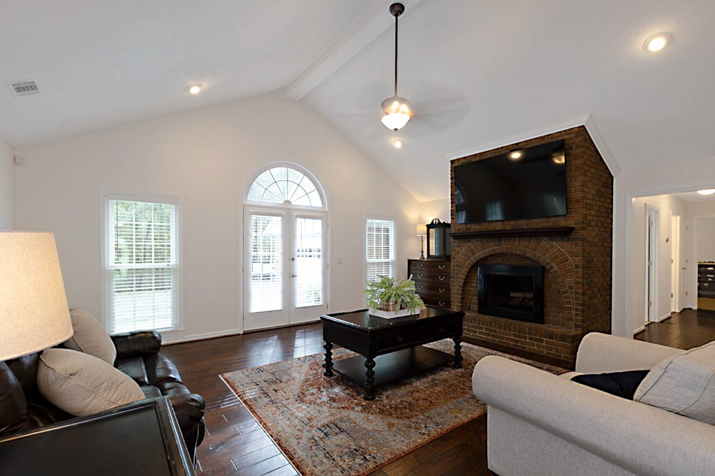 2495 Fortson Road Fortson, GA 31808 - Photo 3 of 30 a living room with furniture a flat screen tv and a fireplace