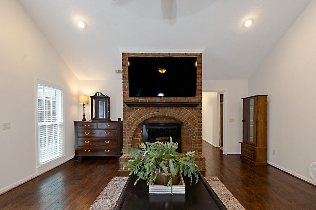2495 Fortson Road Fortson, GA 31808 - Photo 5 of 30 a living room with furniture and a fireplace