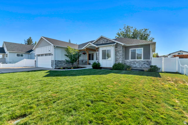 332 South 500 West Payson, UT 84651 - Photo 1 of 50 Contemporary exterior featuring cement board siding with stone accents and a white vinyl fence