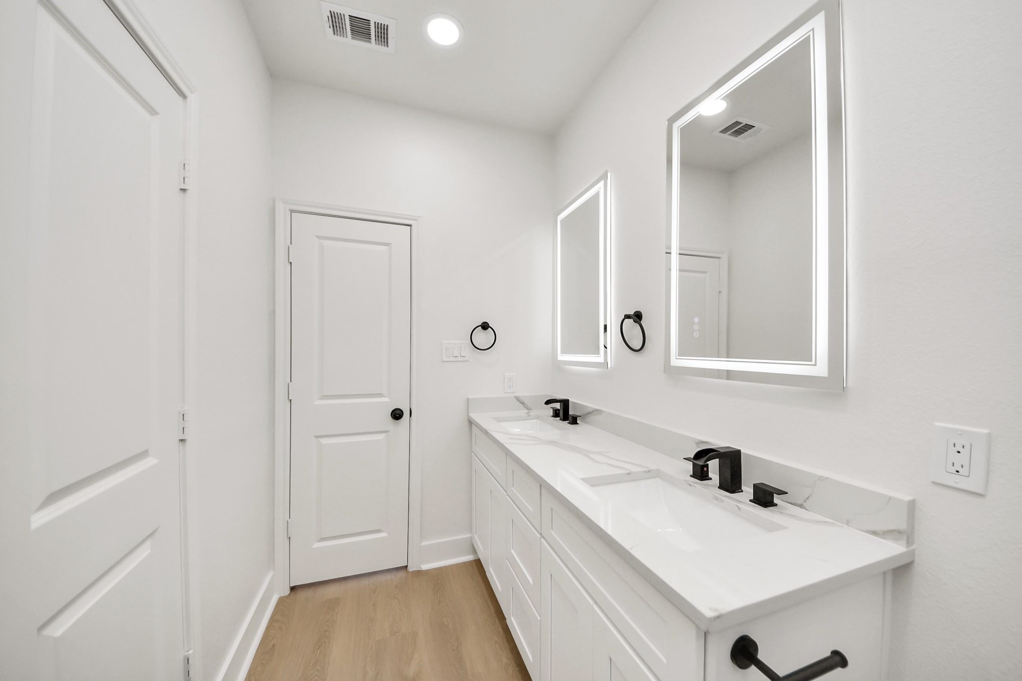 5226 Ricky Street Houston, TX 77033 - Photo 43 of 50 a bathroom with a sink a mirror and a vanity