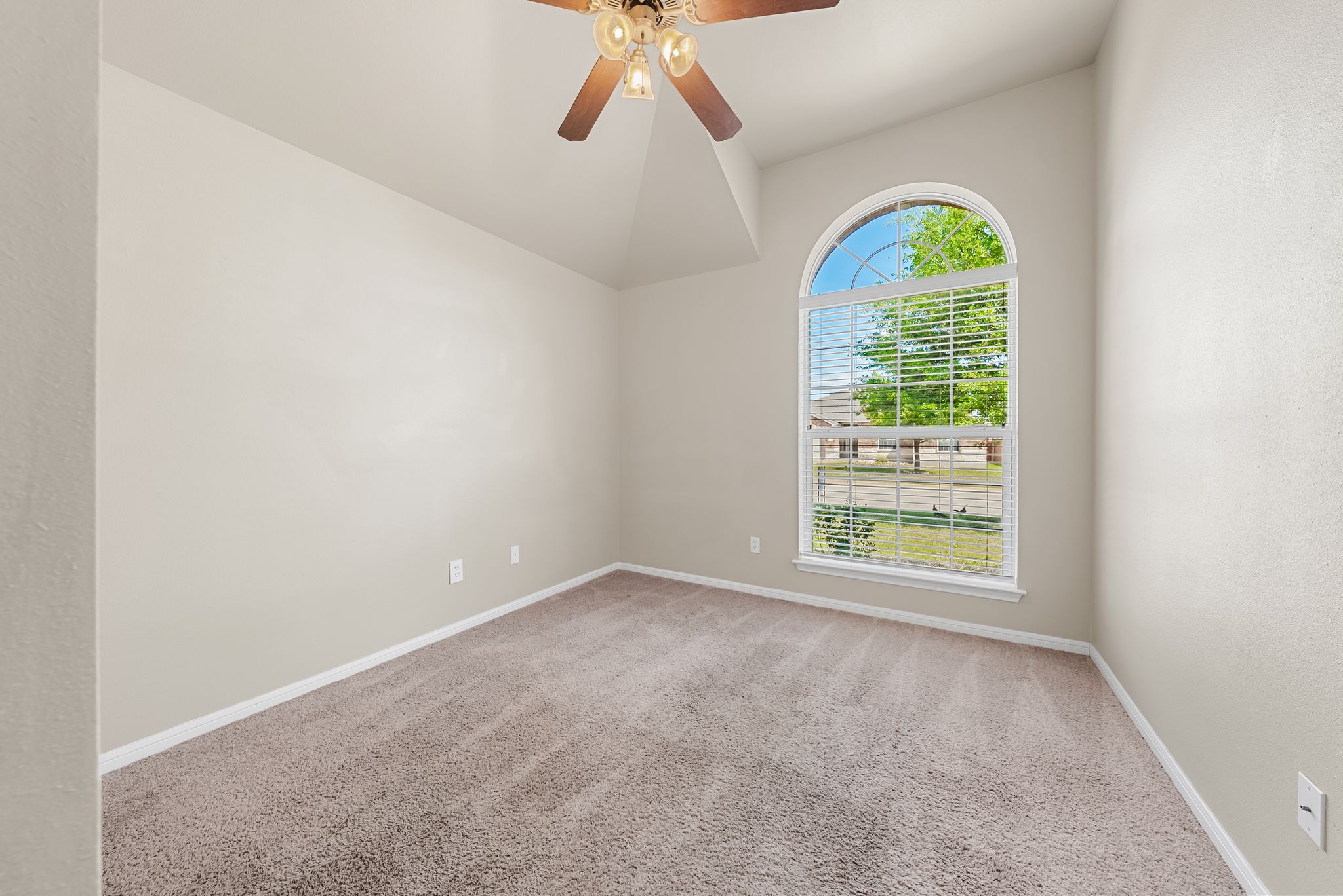7719 Fieldstone Drive Temple, TX 76502 - Photo 7 of 37 Empty room with light carpet, ceiling fan, and vaulted ceiling