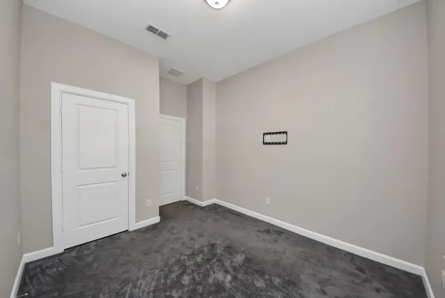 a large kitchen with stainless steel appliances granite countertop a large counter top and a stove top oven