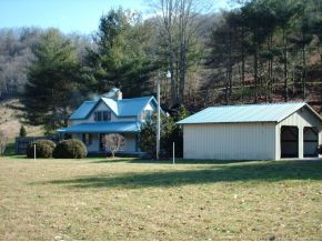 123 McMahan Gibbs Road Roan Mountain, TN 37687 - Photo 5 of 10 view of home with garage