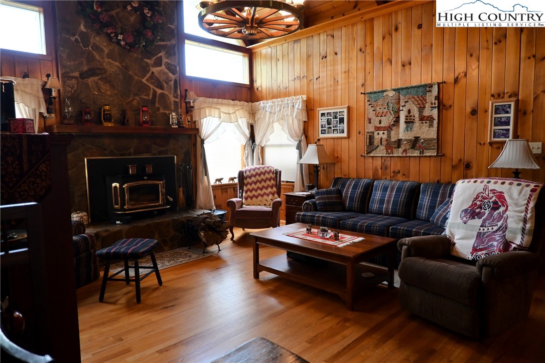 280 Smoky Hollow Road Laurel Springs, NC 28644 - Photo 11 of 42 a living room with furniture and a fireplace
