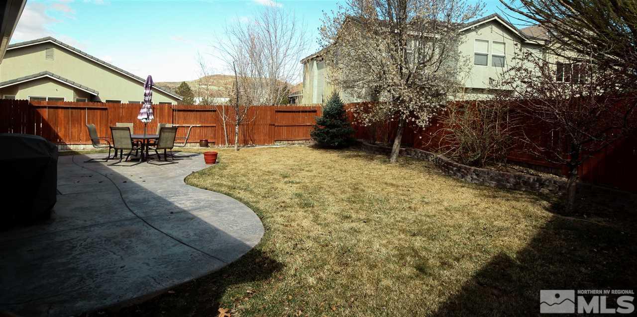 1707 River Gorge Court Reno, NV 89521 - Photo 15 of 18 a view of a house with backyard and sitting area
