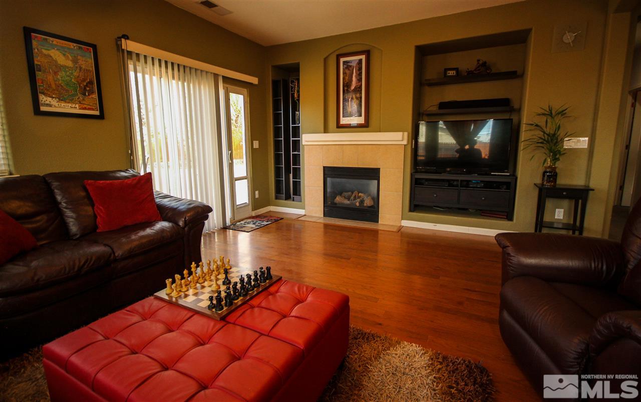 1707 River Gorge Court Reno, NV 89521 - Photo 4 of 18 a living room with furniture or couch and a fireplace
