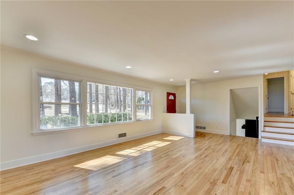3463 Northlake Way Atlanta, GA 30340 - Photo 13 of 73 a view of empty room with wooden floor and fan