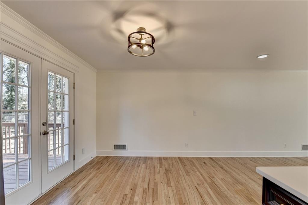 3463 Northlake Way Atlanta, GA 30340 - Photo 14 of 73 an empty room with wooden floor and windows