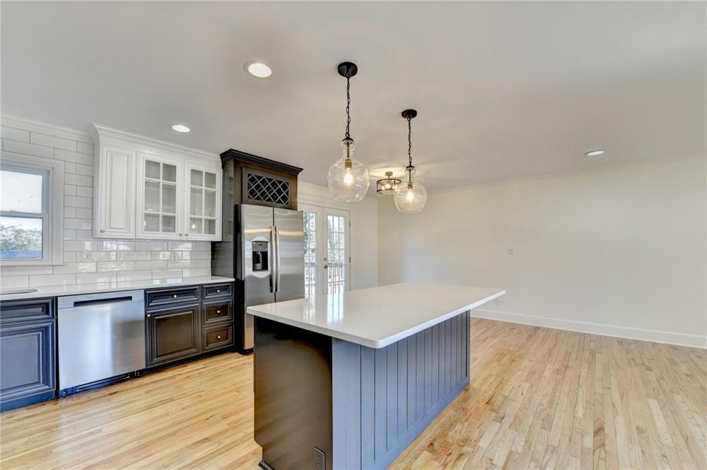3463 Northlake Way Atlanta, GA 30340 - Photo 19 of 73 a open kitchen with a sink dishwasher a stove and a wooden floors