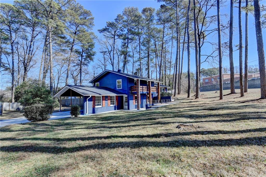 3463 Northlake Way Atlanta, GA 30340 - Photo 2 of 73 a front view of a house with a yard