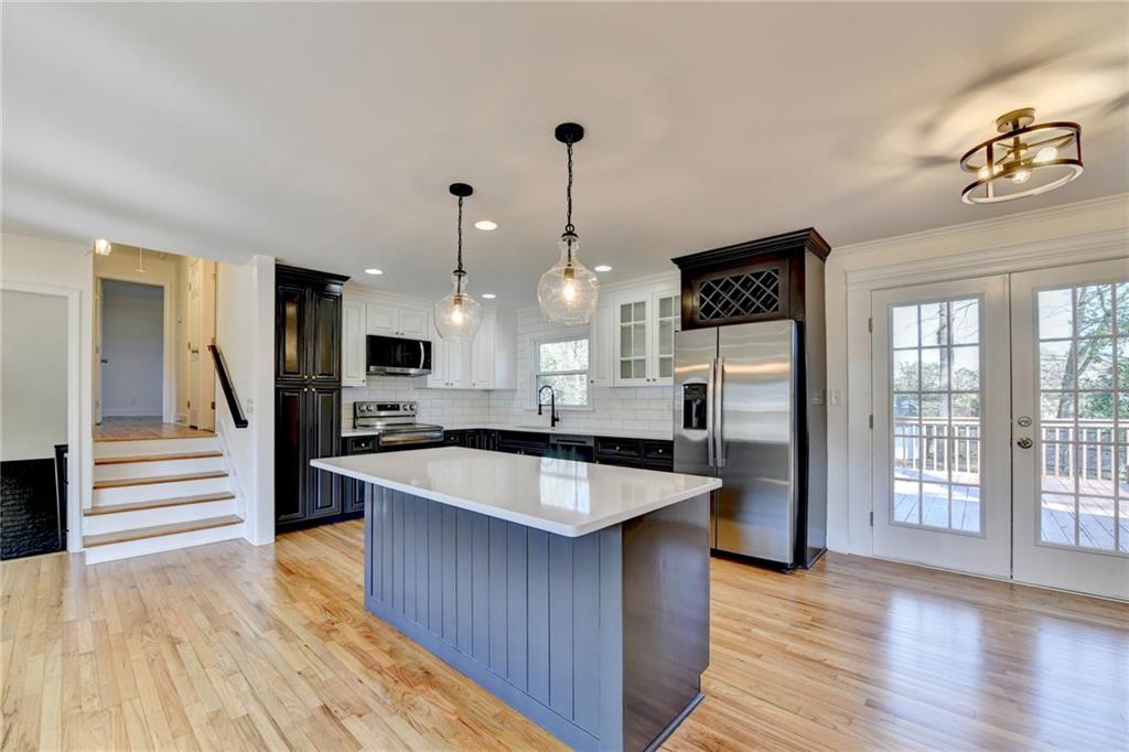 3463 Northlake Way Atlanta, GA 30340 - Photo 21 of 73 a large kitchen with granite countertop a large counter top and stainless steel appliances