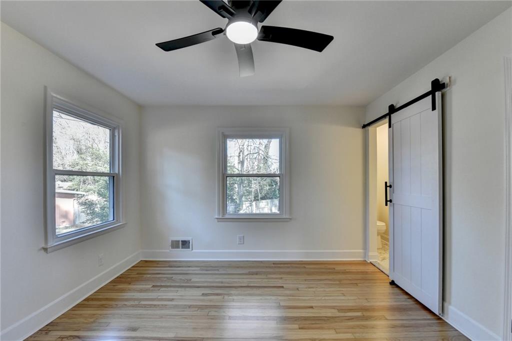 3463 Northlake Way Atlanta, GA 30340 - Photo 30 of 73 a view of an empty room with wooden floor and a window