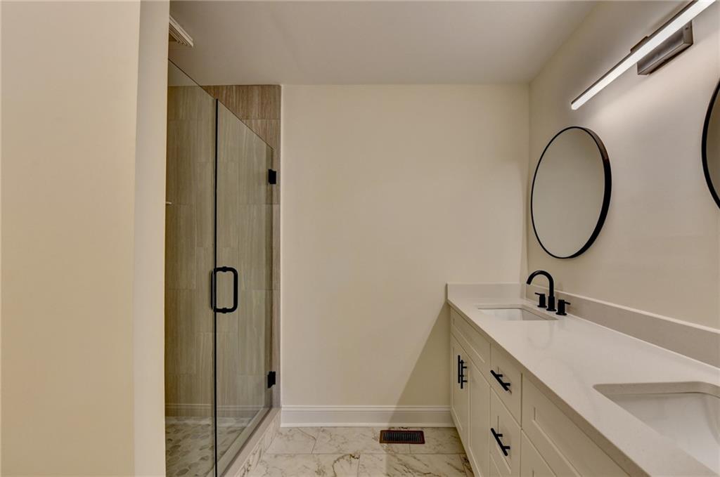 3463 Northlake Way Atlanta, GA 30340 - Photo 34 of 73 a bathroom with a sink and a mirror