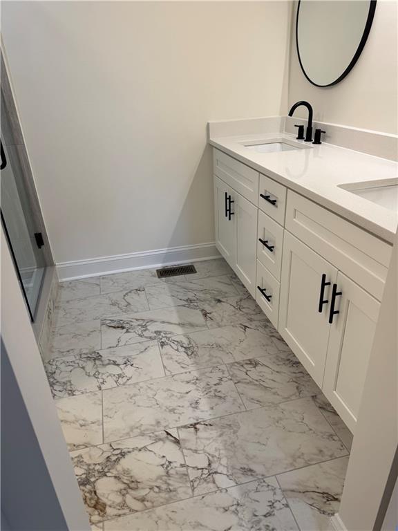 3463 Northlake Way Atlanta, GA 30340 - Photo 35 of 73 a bathroom with a sink and a mirror