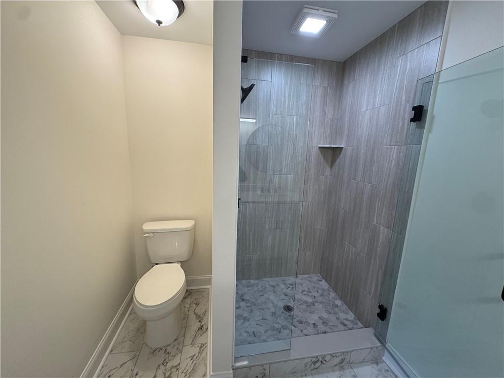 3463 Northlake Way Atlanta, GA 30340 - Photo 37 of 73 a bathroom with a toilet and a shower