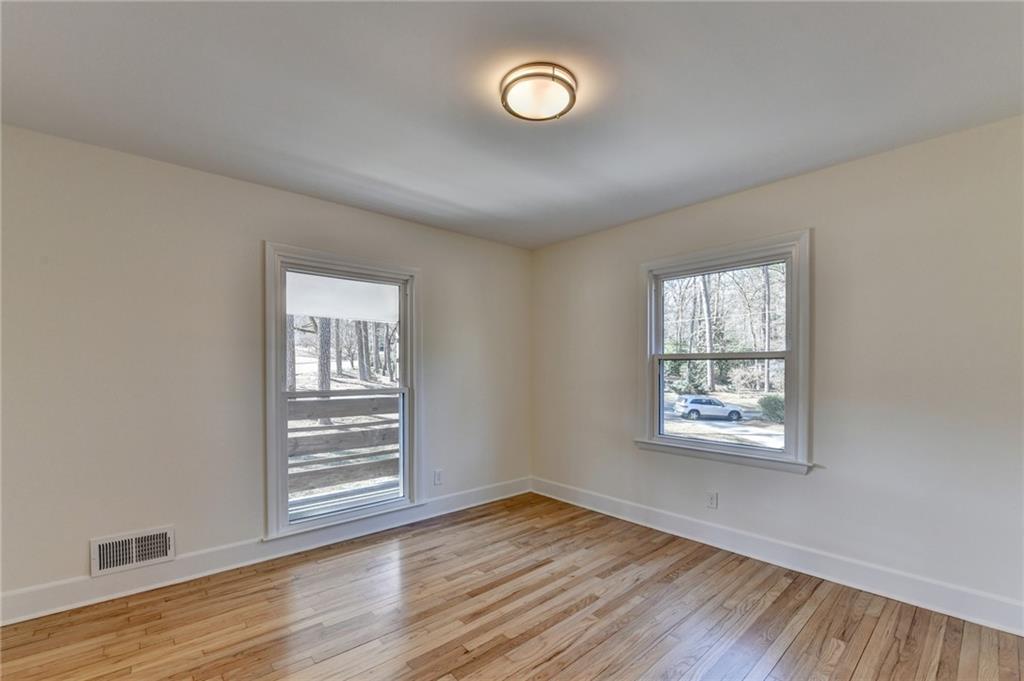 3463 Northlake Way Atlanta, GA 30340 - Photo 38 of 73 a view of an empty room with wooden floor and a window