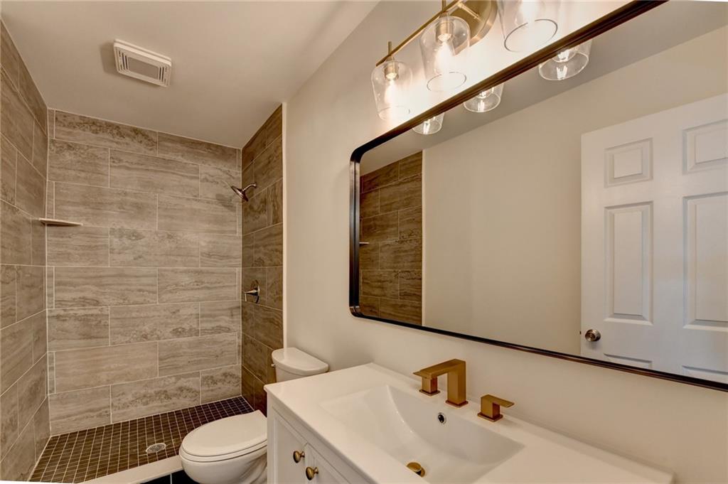 3463 Northlake Way Atlanta, GA 30340 - Photo 41 of 73 a bathroom with a sink a toilet and shower