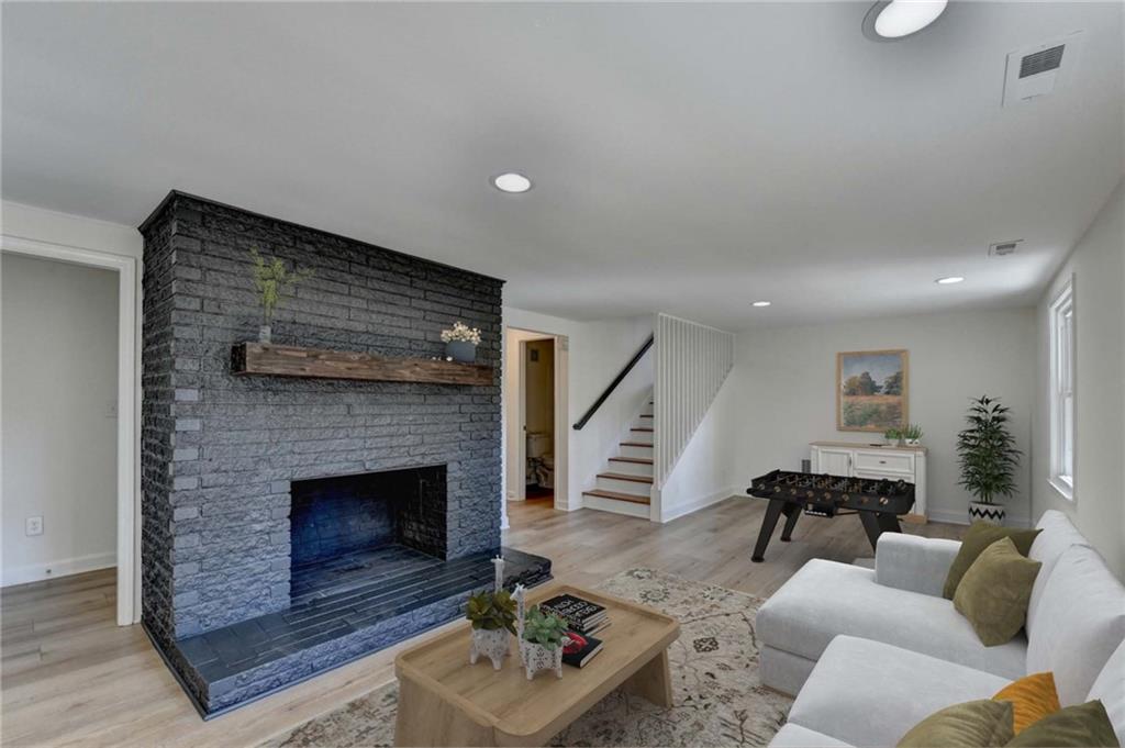 3463 Northlake Way Atlanta, GA 30340 - Photo 48 of 73 a living room with furniture and a fireplace