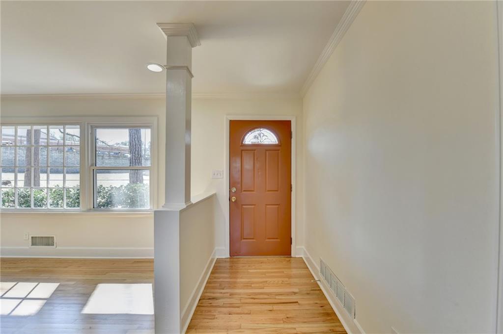 3463 Northlake Way Atlanta, GA 30340 - Photo 8 of 73 a view of a hallway with wooden floor and windows