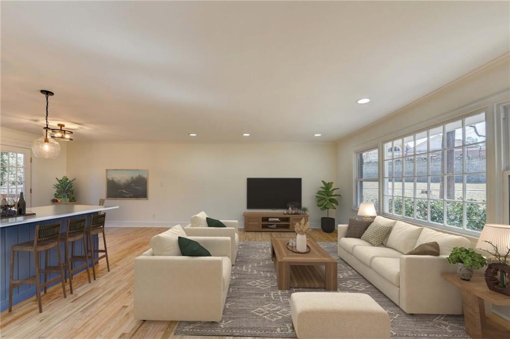 3463 Northlake Way Atlanta, GA 30340 - Photo 10 of 73 a living room with furniture a flat screen tv and a large window
