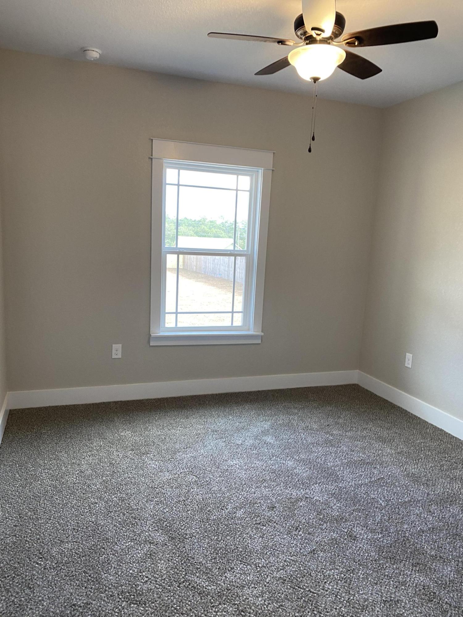 3950 Painter Branch Road Crestview, FL 32539 - Photo 14 of 18 an empty room with a window