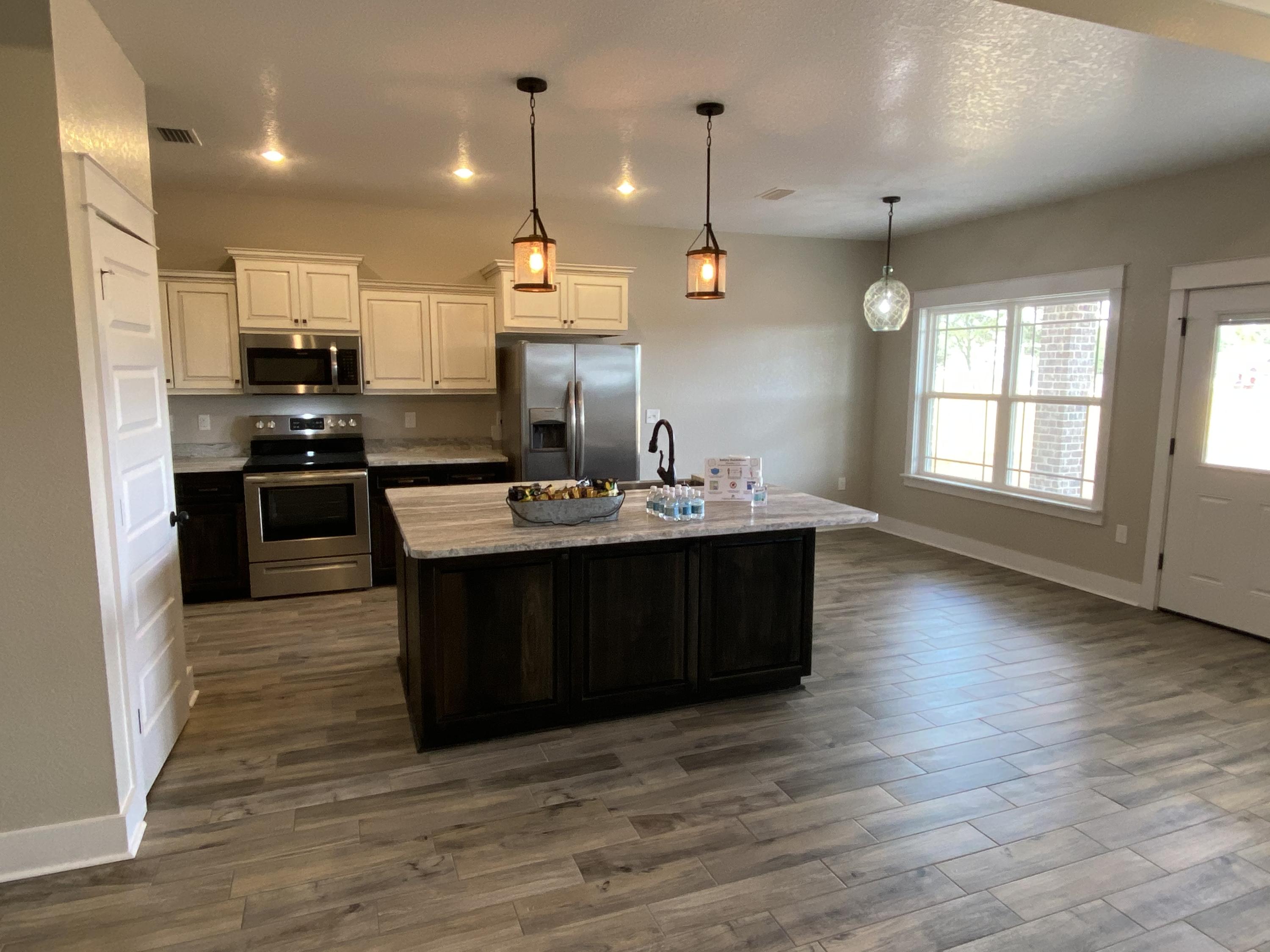 3950 Painter Branch Road Crestview, FL 32539 - Photo 4 of 18 a kitchen with a sink and cabinets