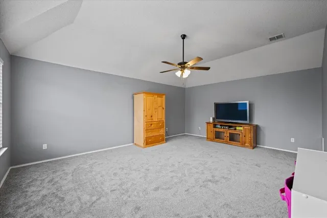 a view of an empty room with a flat screen tv