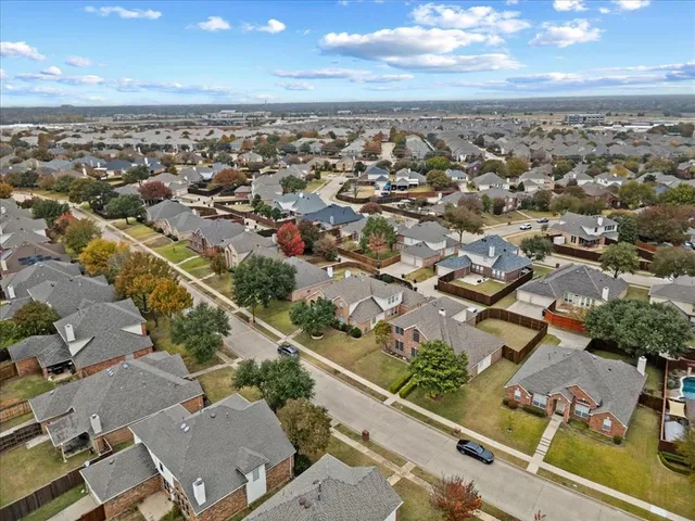an aerial view of residential building with parking space