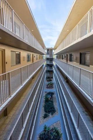 a view of a balcony with staircase