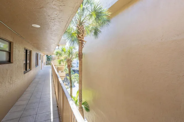 a view of a hallway with paintings on the wall