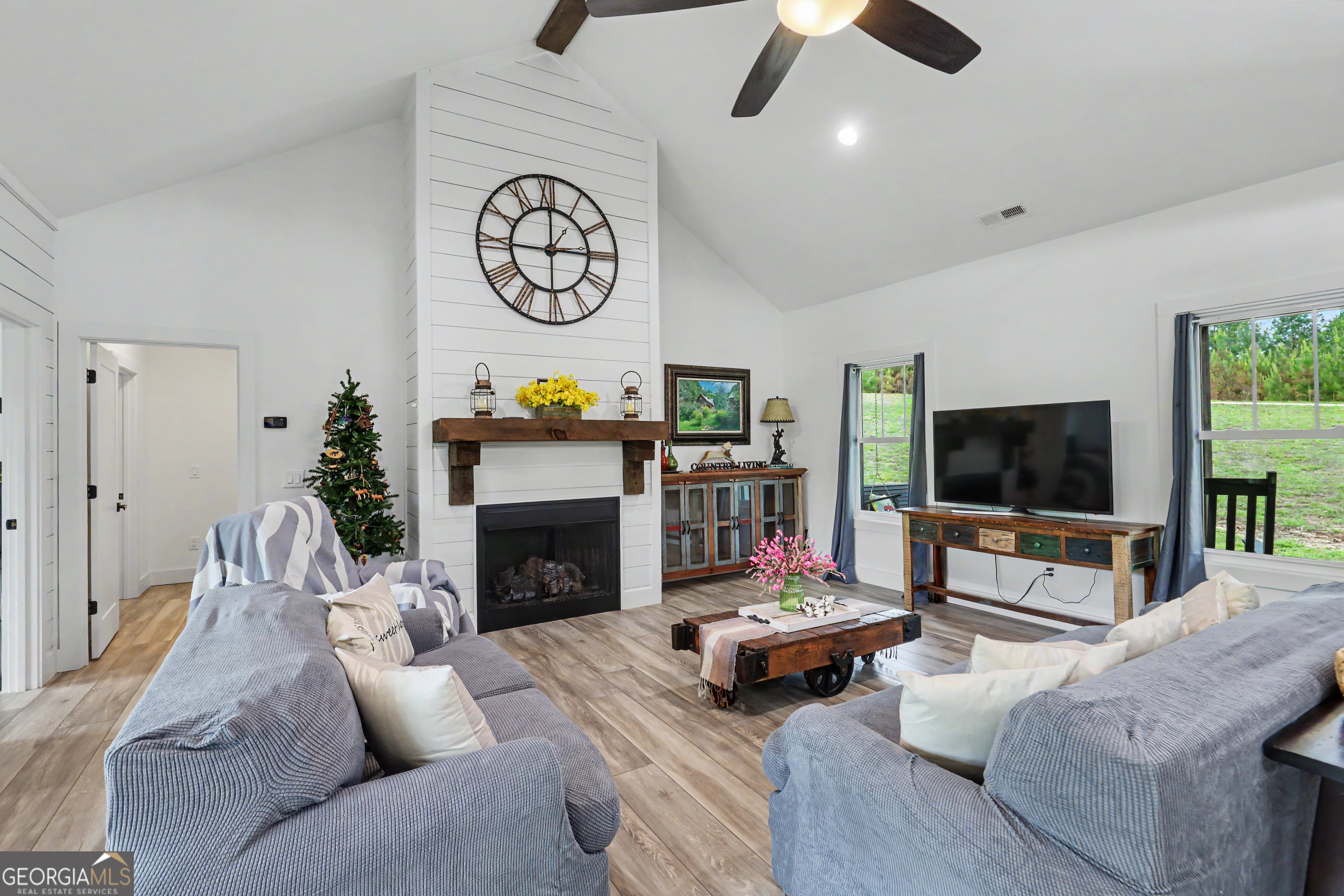 1424 Ridge Pointe Way Blairsville, GA 30512 - Photo 12 of 114 a living room with furniture and a flat screen tv