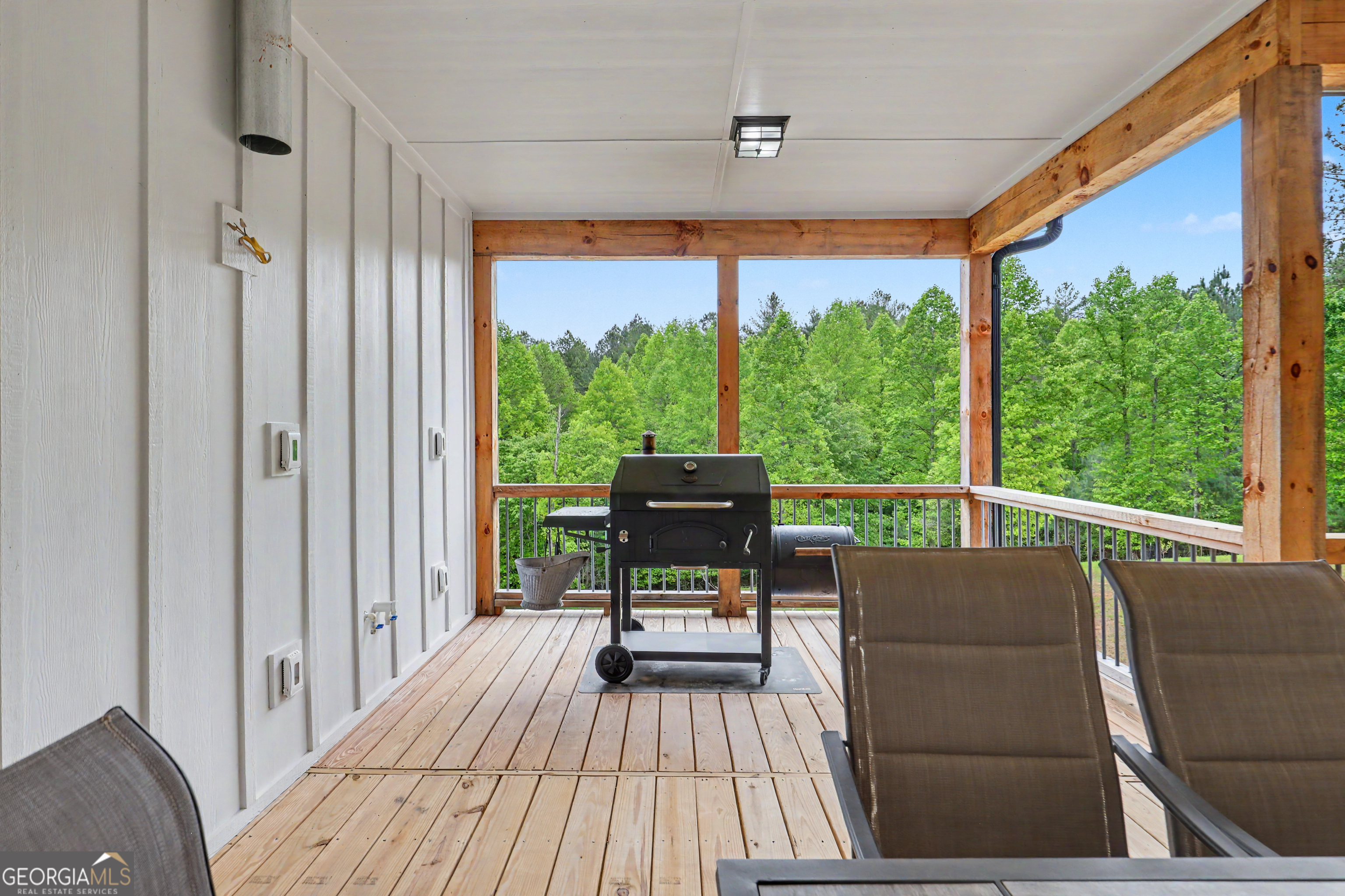 1424 Ridge Pointe Way Blairsville, GA 30512 - Photo 35 of 114 a living room with a floor to ceiling window and wooden floor