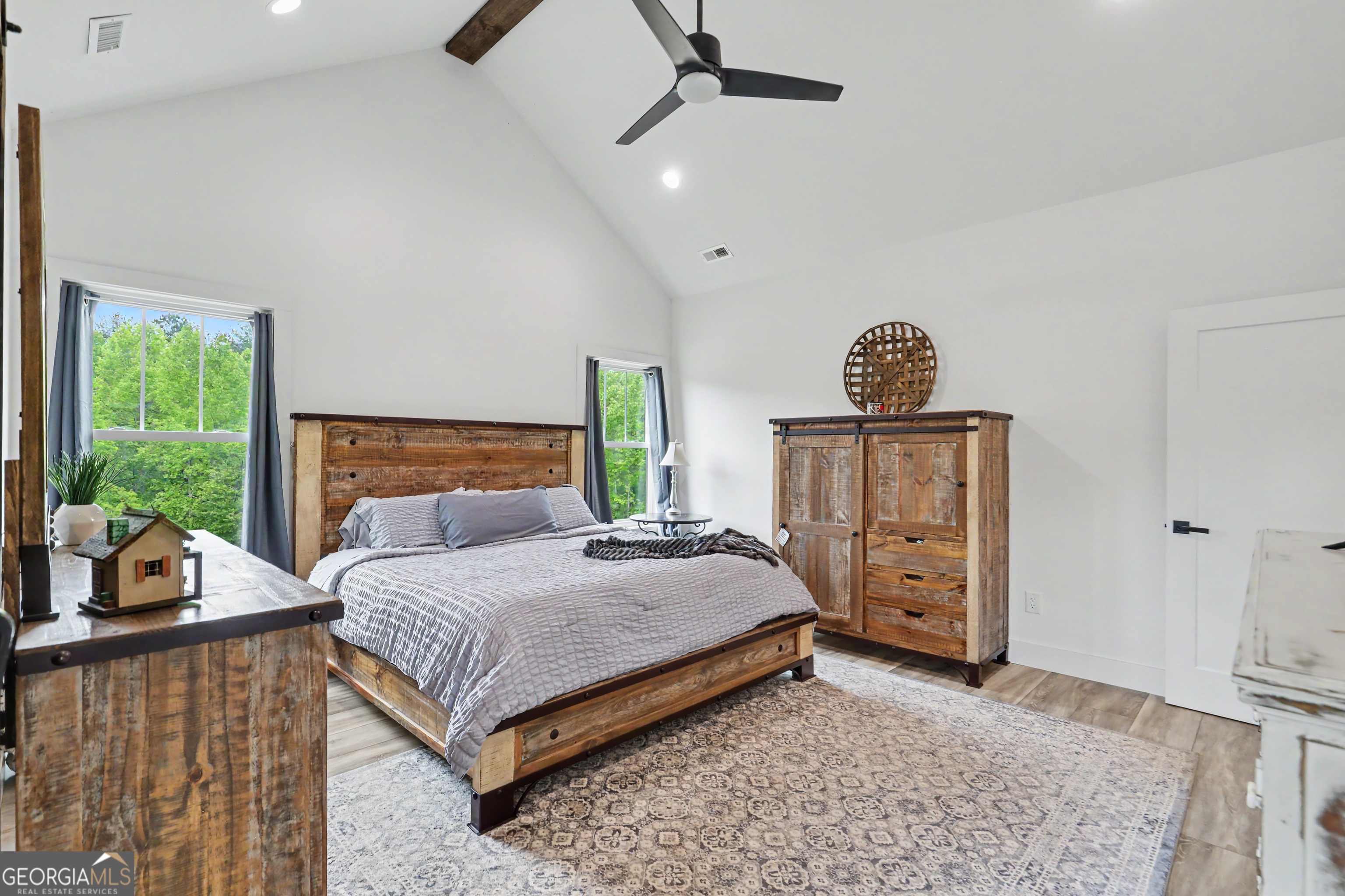 1424 Ridge Pointe Way Blairsville, GA 30512 - Photo 46 of 114 a bedroom with a bed and wooden floor
