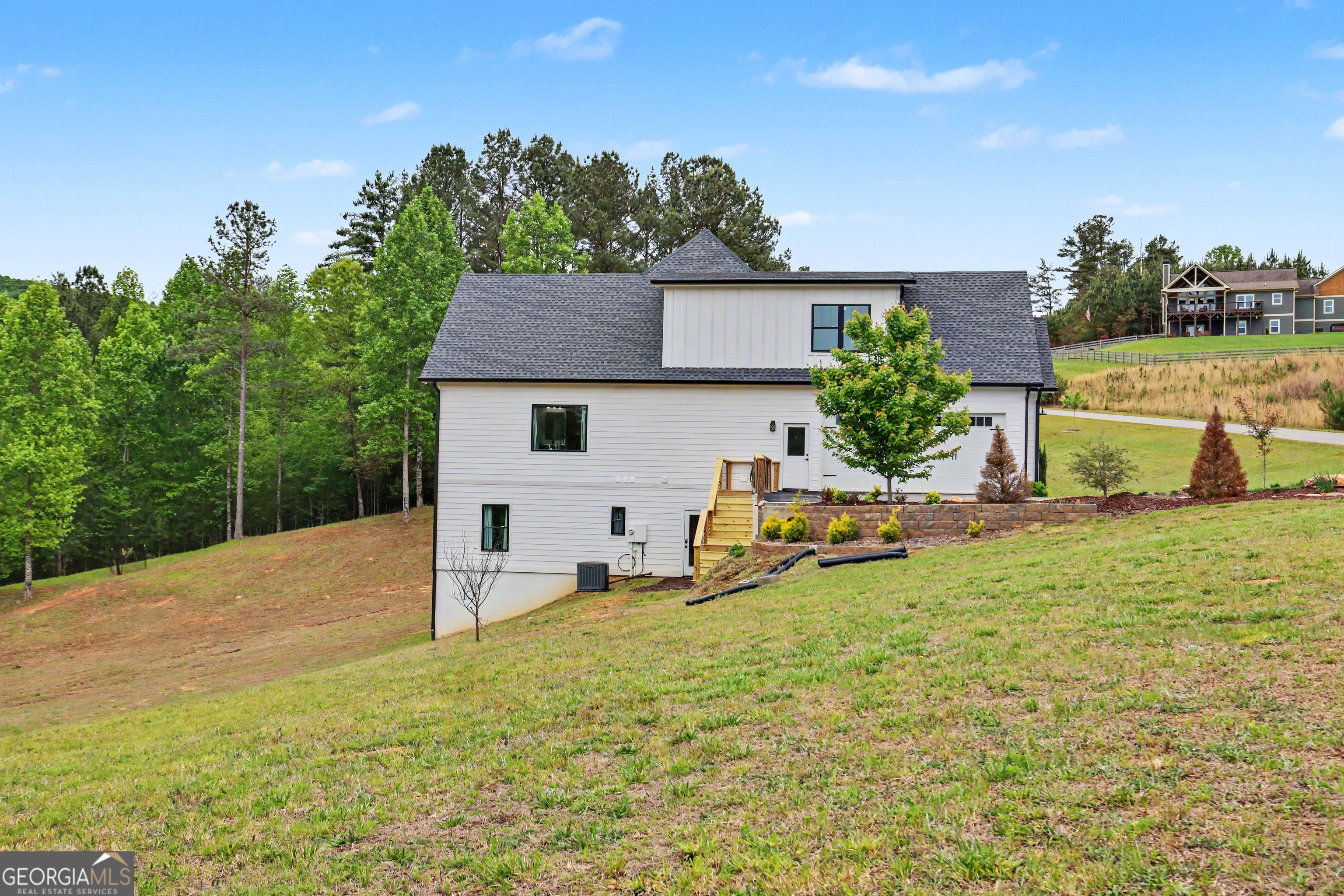 1424 Ridge Pointe Way Blairsville, GA 30512 - Photo 81 of 114 a view of a house with backyard and sitting area