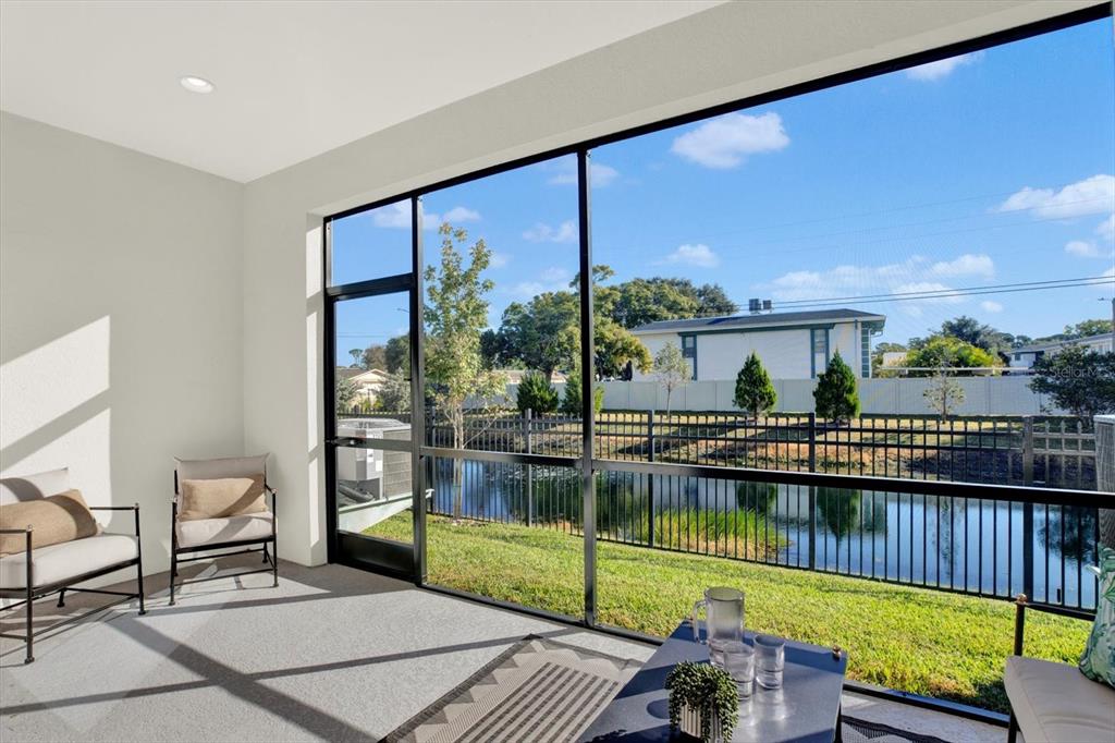 a view of a balcony with lake view and a potted plant
