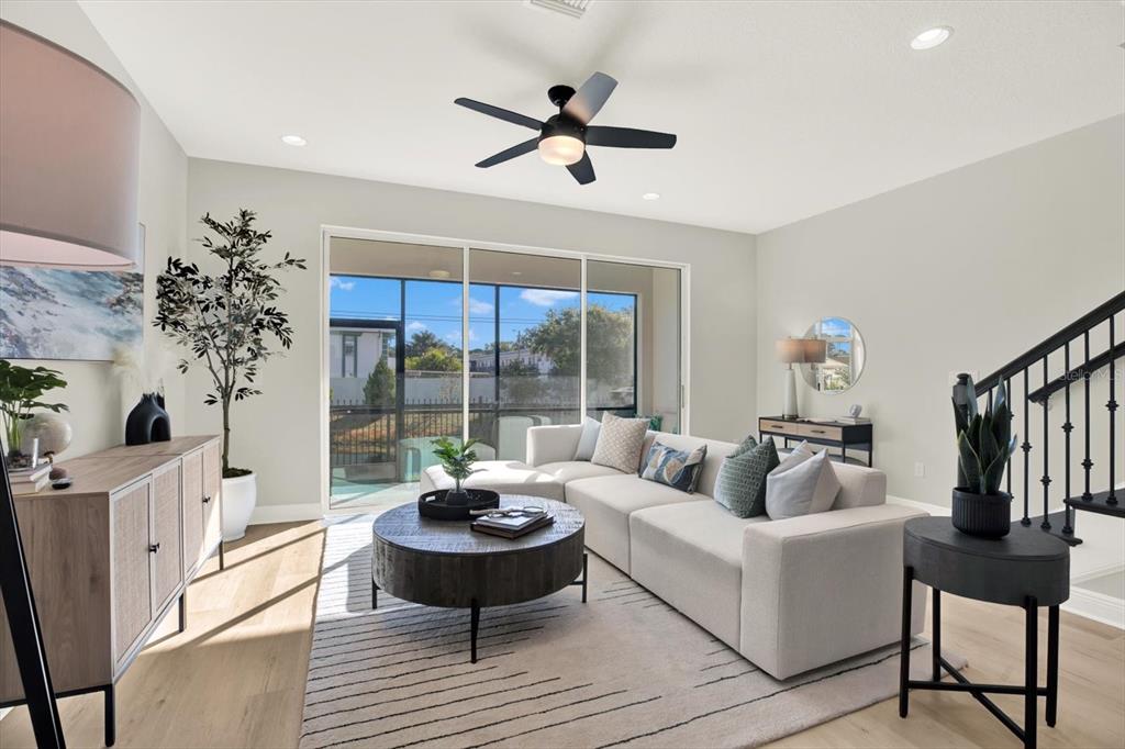 7765 93rd Street North Seminole, FL 33777 - Photo 11 of 29 a living room with furniture and a large window