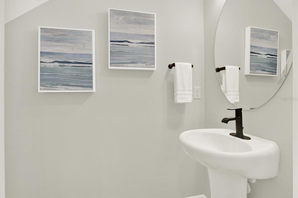 7765 93rd Street North Seminole, FL 33777 - Photo 13 of 29 a bathroom with a sink and a mirror