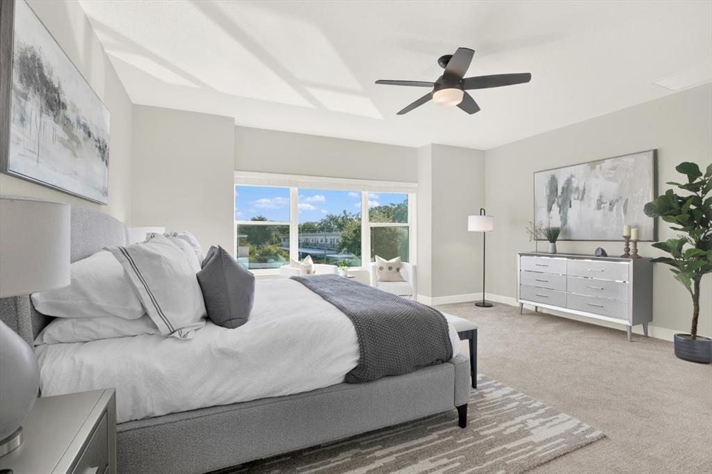 7765 93rd Street North Seminole, FL 33777 - Photo 17 of 29 a bedroom with bed and a large window