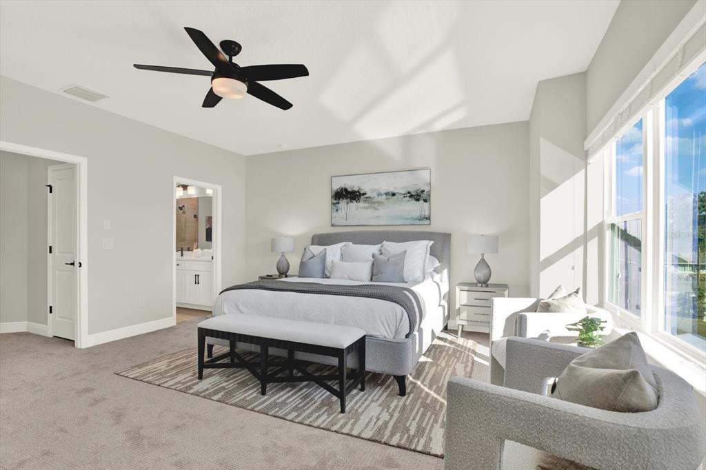 7765 93rd Street North Seminole, FL 33777 - Photo 19 of 29 a bed room with a bed and a couch