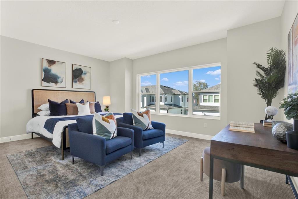 7765 93rd Street North Seminole, FL 33777 - Photo 24 of 29 a living room with furniture and a flat screen tv