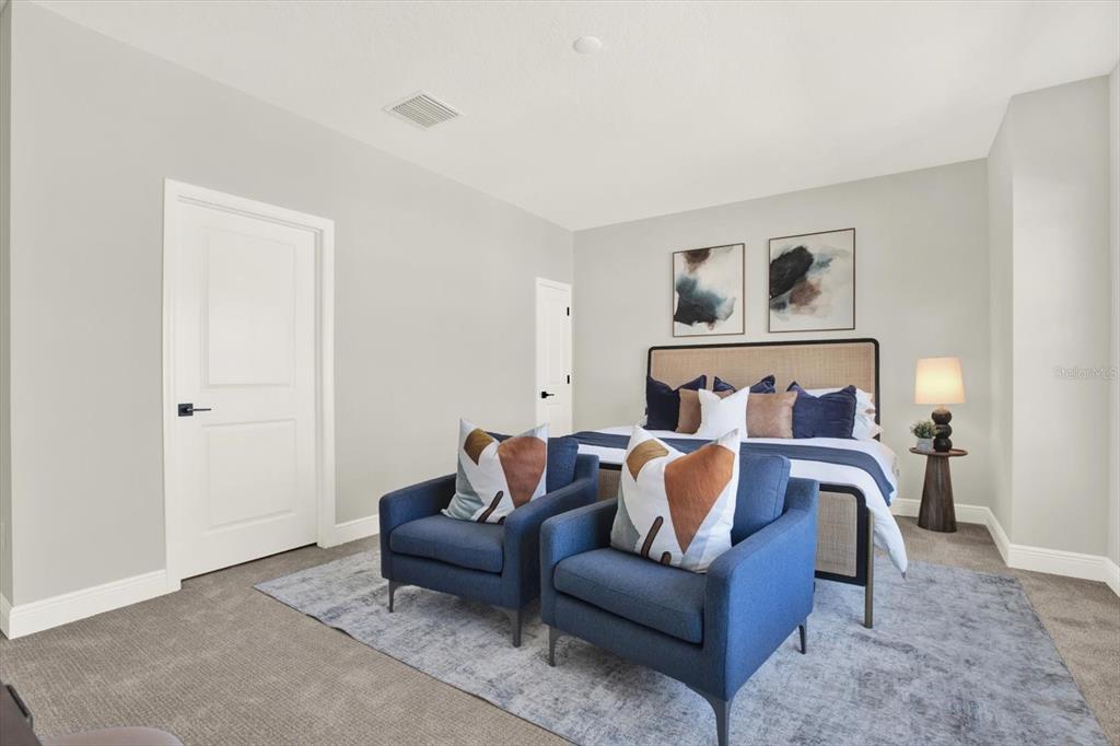 7765 93rd Street North Seminole, FL 33777 - Photo 25 of 29 a bed room with furniture and a wall painting