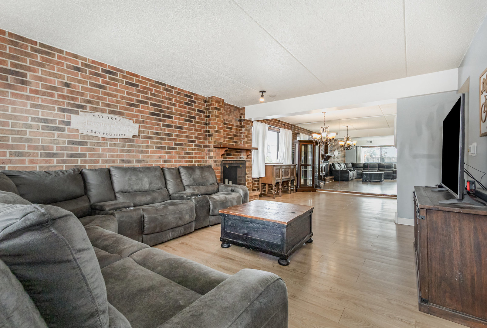 1420 Woodbridge Road, Unit 1E Joliet, IL 60436 - Photo 4 of 15 a living room with furniture and a flat screen tv