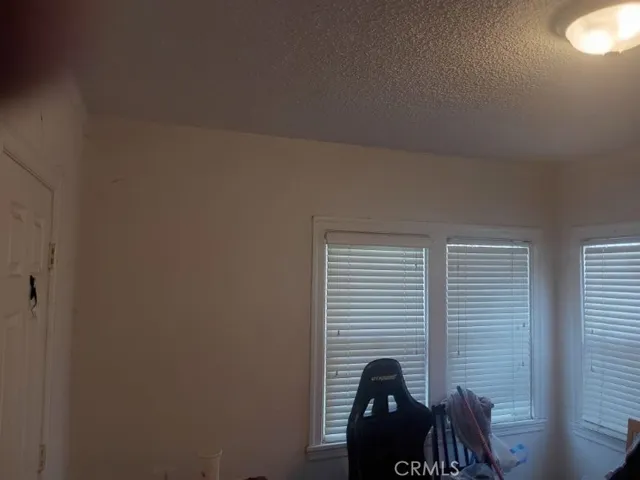 a view of a room that has a bench in it