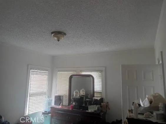 a living room with furniture and a mirror