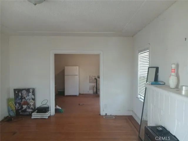 a view of hallway with livingroom