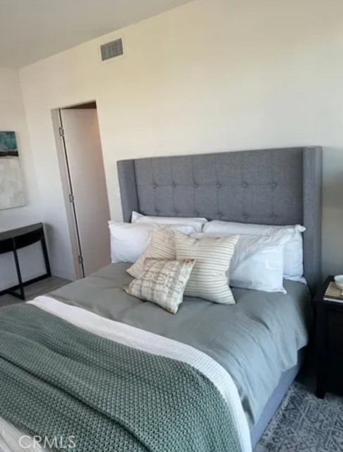 6719 Sepulveda Boulevard Van Nuys, CA 91406 - Photo 18 of 60 a bedroom with a bed and a mirror