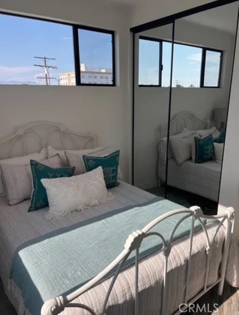 6719 Sepulveda Boulevard Van Nuys, CA 91406 - Photo 19 of 60 a bedroom with a bed and window